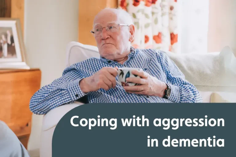 An elderly man sat on a sofa looking agitated, with the text 'coping with aggression in dementia'