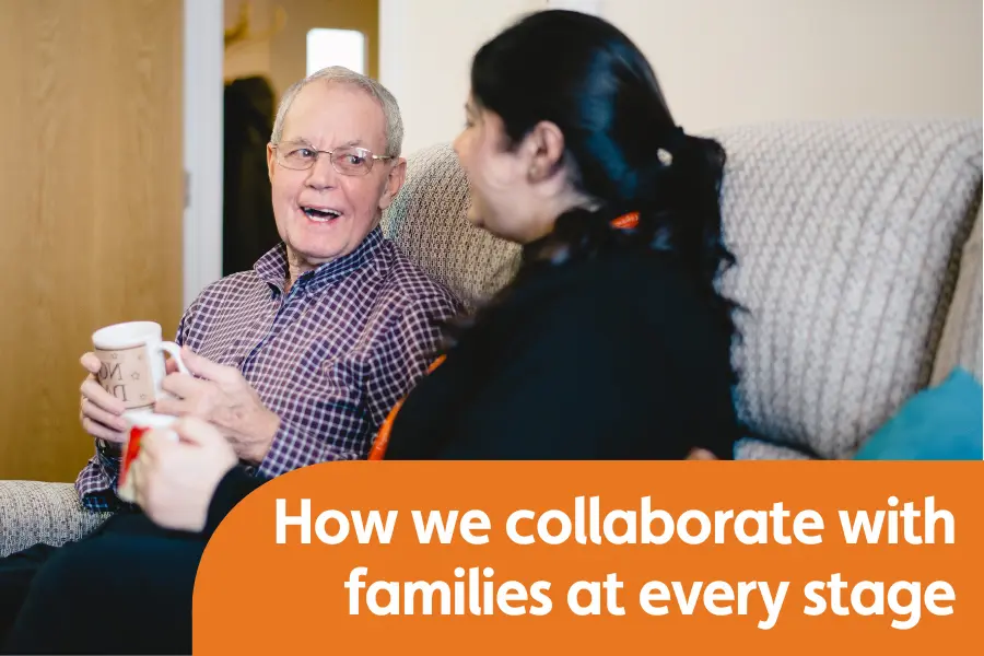 Featured image for how we collaborate with families, showing elderly gentleman talking to his carer on a sofa smiling