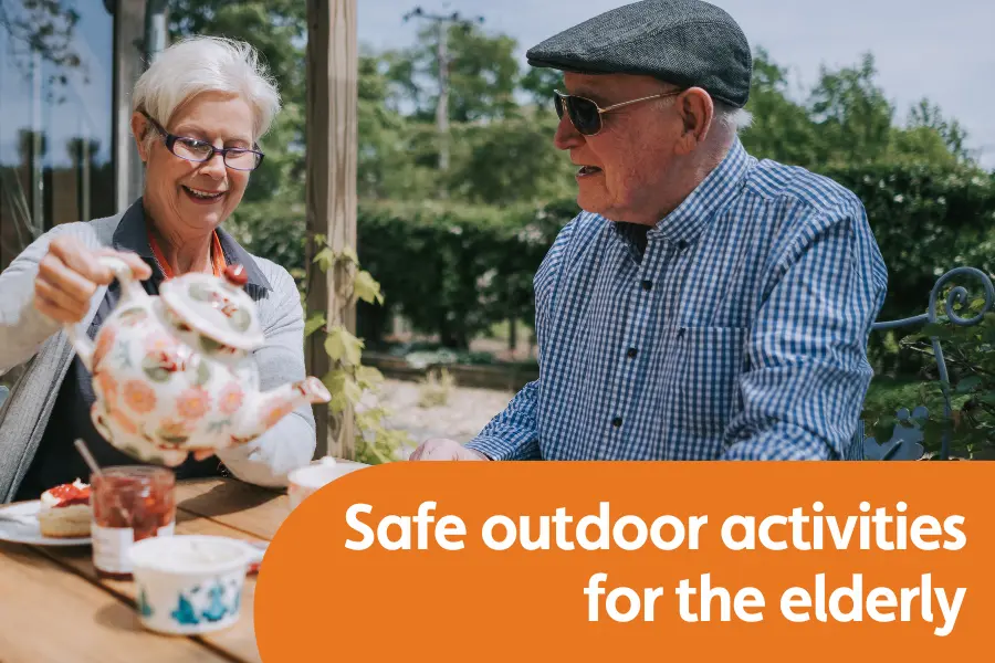 Featured image for blog titled Safe Outdoor Activities for Elderly Loved Ones in Spring. Shows an elderly gentleman and his carer sat in the garden having tea together