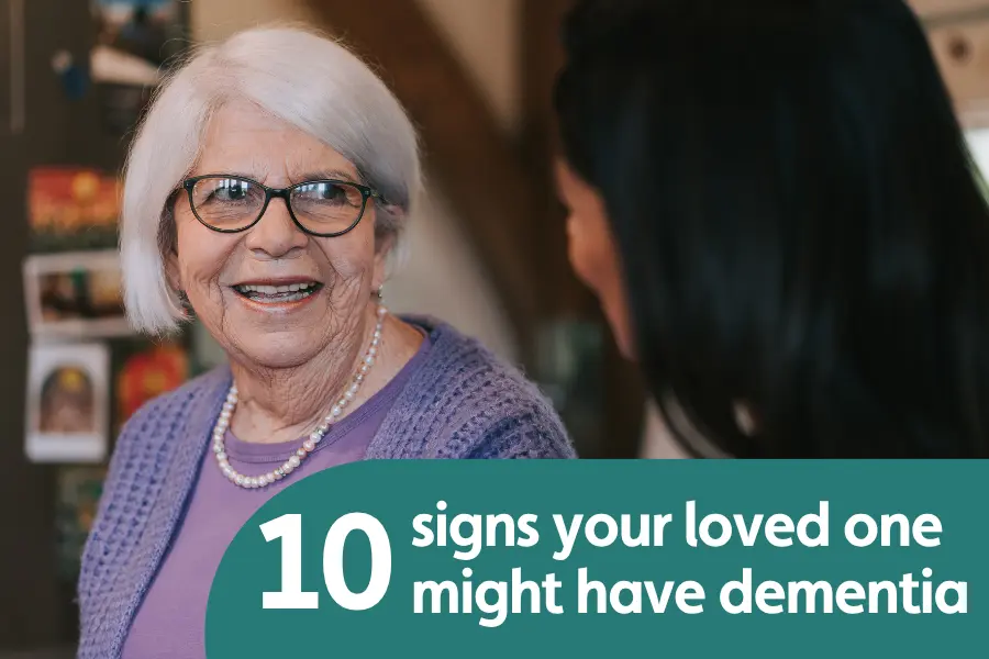 Featured image for blog on ten signs your loved one might have dementia. Image shows and elderly lady smiling at someone with their back to the camera
