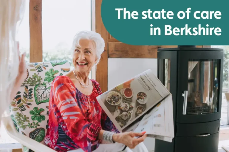 Featured for image for a blog outlining the state pf care in Berkshire. Image shows an older lady sat by a window showing somebody a section in a newspaper while smiling